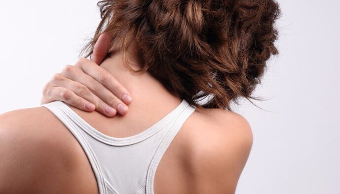 a girl has a pain in her neck